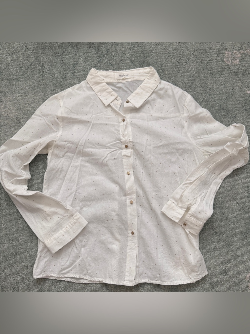 White button up shirt with small gold triangle polka dots